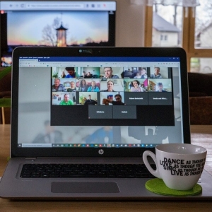 Laptop displaying a web conference happening